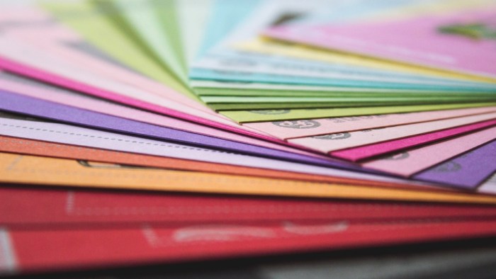 An image of a colourful spread of documents.